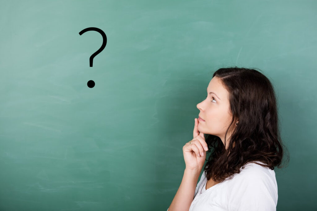 woman thinking with question mark on background