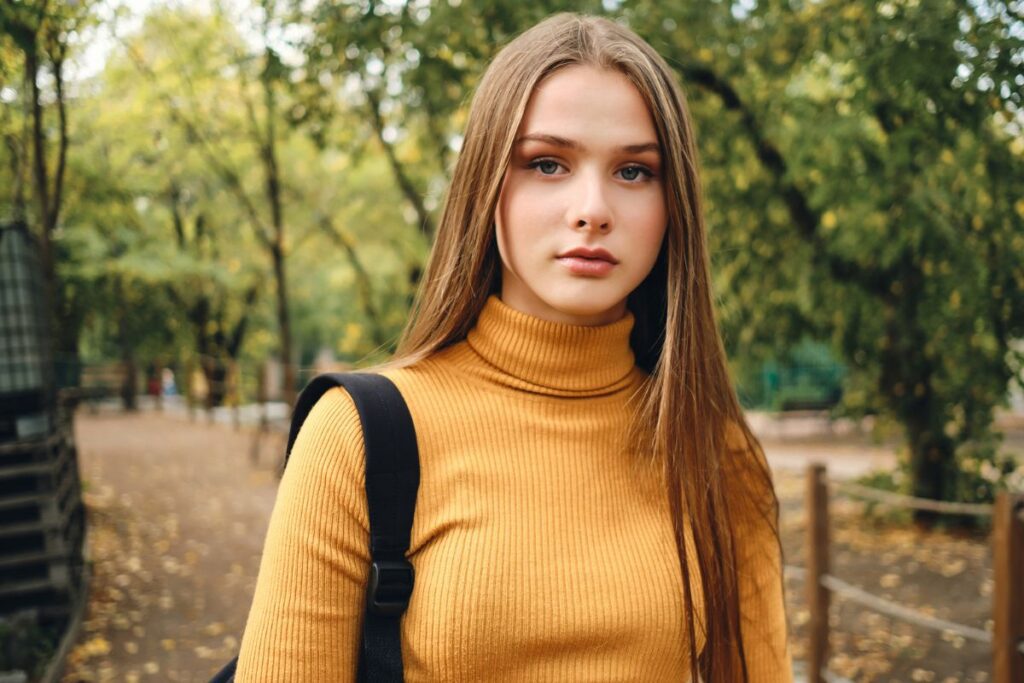 Teenager walking outdoors in the fall.
