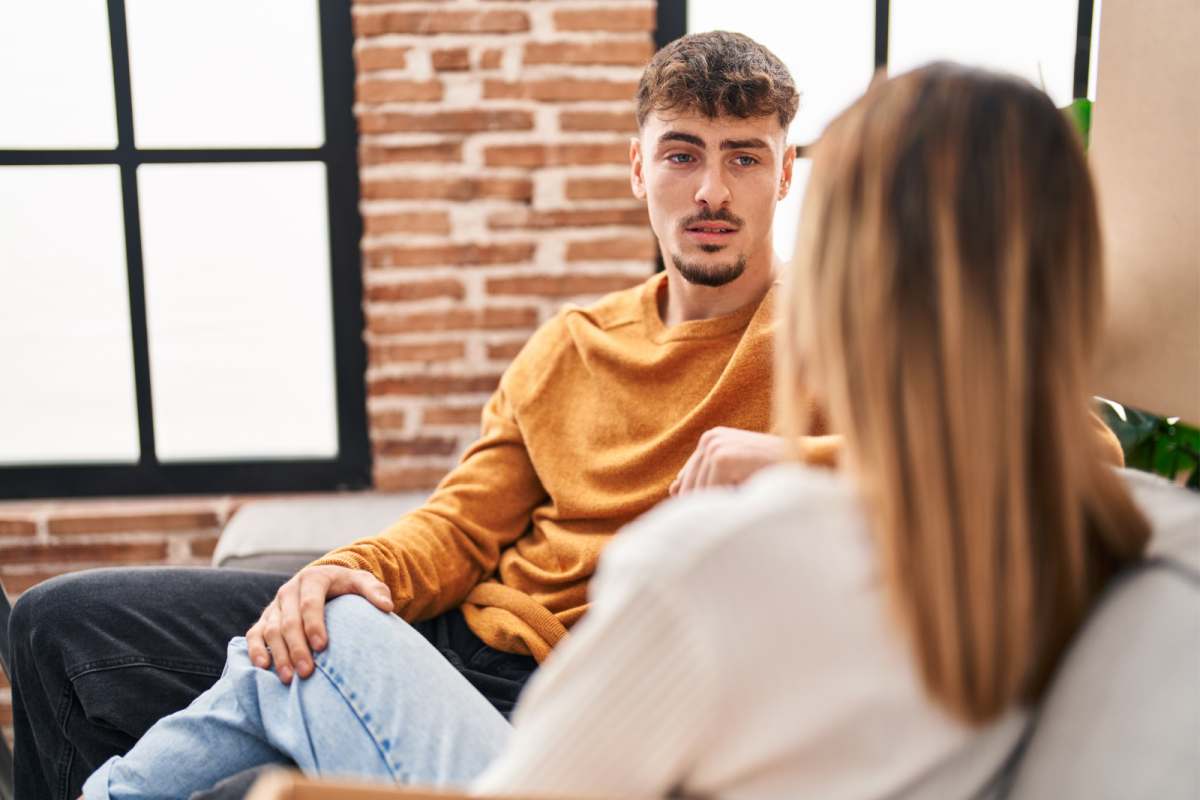 couple talking on couch